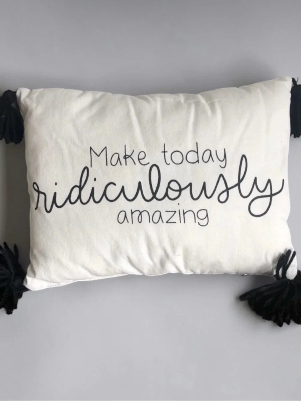 White Decorative Pillow with Black Script and Tassels